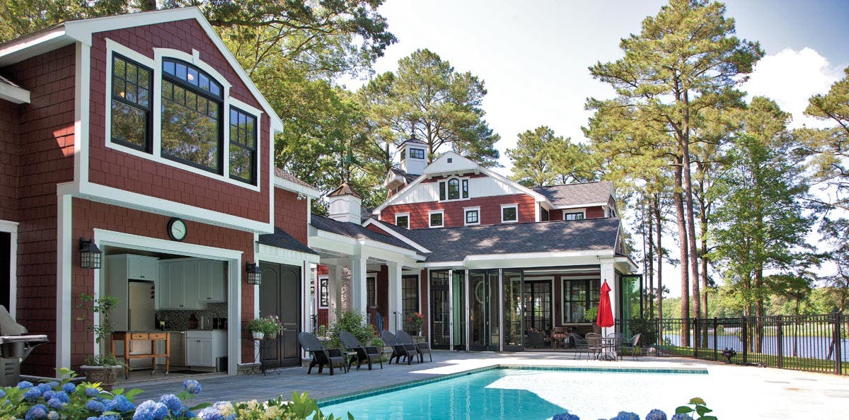 exterior view of home with pool and ultra series sterling double hung, folding door, crank-out awning and double hung transom