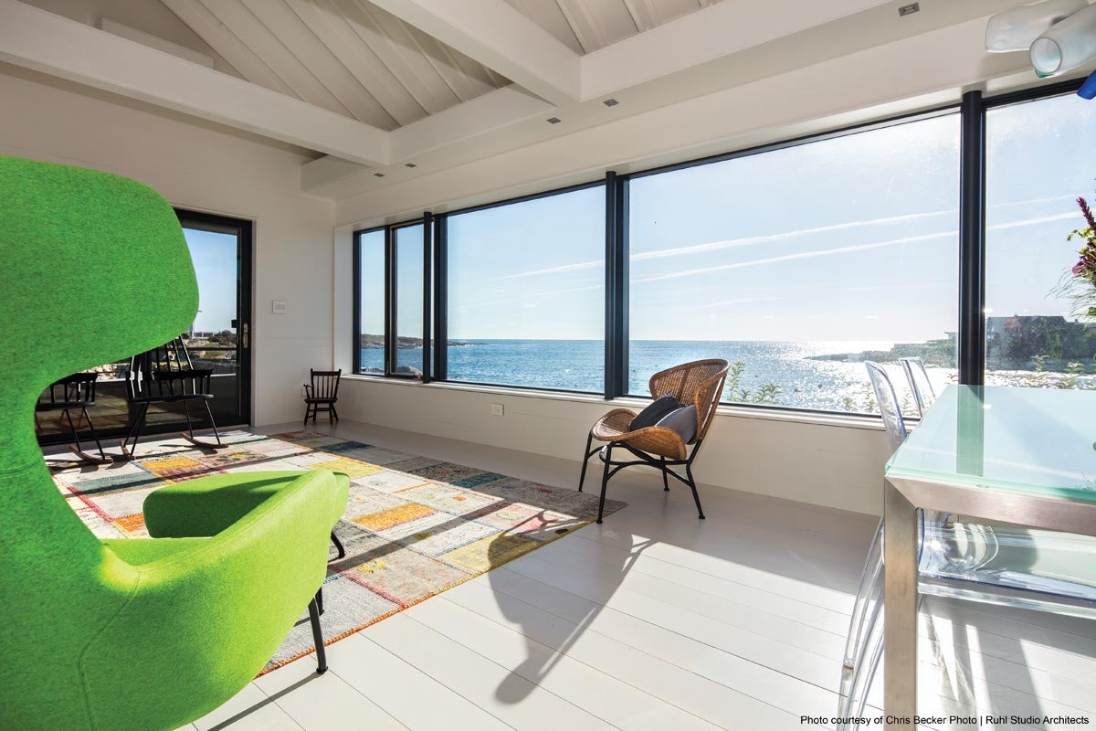 windows and doors with large expanses of glass to a home brightens the space and minimizes the need for light fixtures