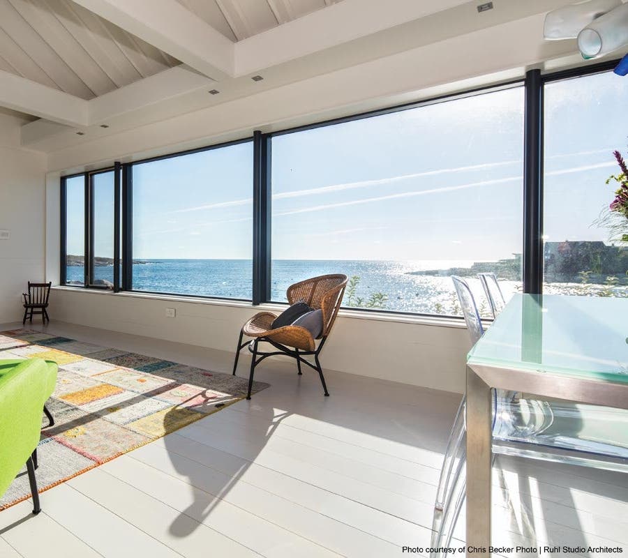 windows and doors with large expanses of glass to a home brightens the space and minimizes the need for light fixtures