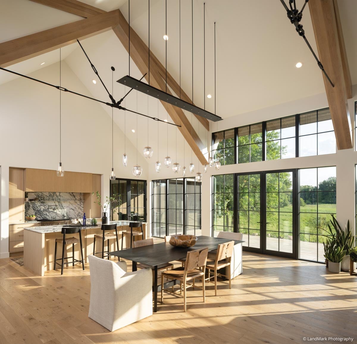 AN322 - kitchen and dining room with high ceilings and wood beams; VistaLuxe Collection windows and door