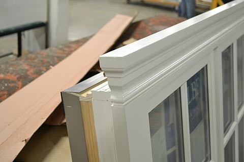 CS67-3, Casements with Spread Mull & Wood Trim with Returned Ends (exterior top closeup)