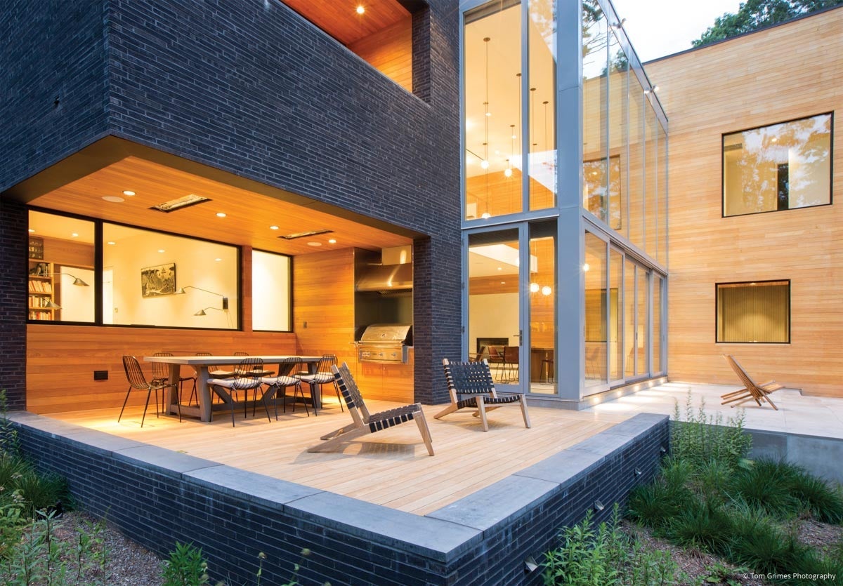 AN102 - modern outdoor patio with two story residential glass wall