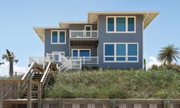 AM903 - exterior view of beach home with multiple Forgent windows