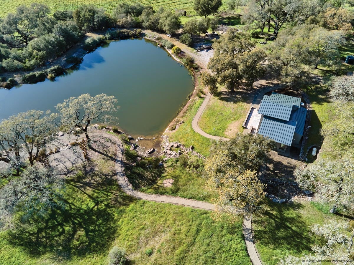AM209 - aerial view of guest house next to a large pond