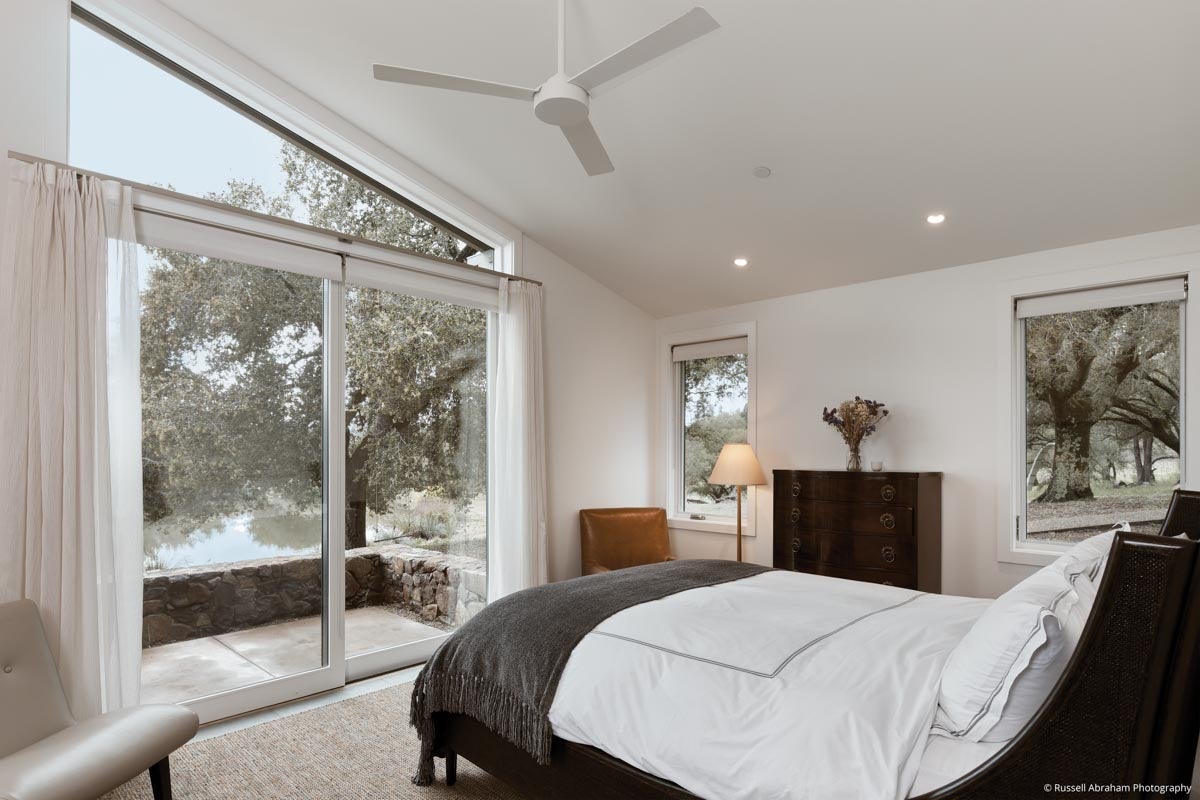 AM232 - Kolbe VistaLuxe WD geometric direct set over a sliding patio door featured in guest house bedroom
