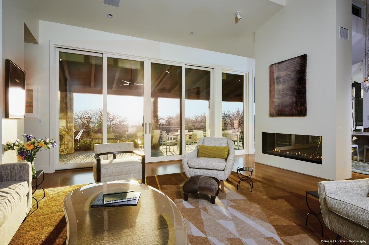 AM217 - Kolbe VistaLuxe WD complementary sliding door featured in living room at sunset