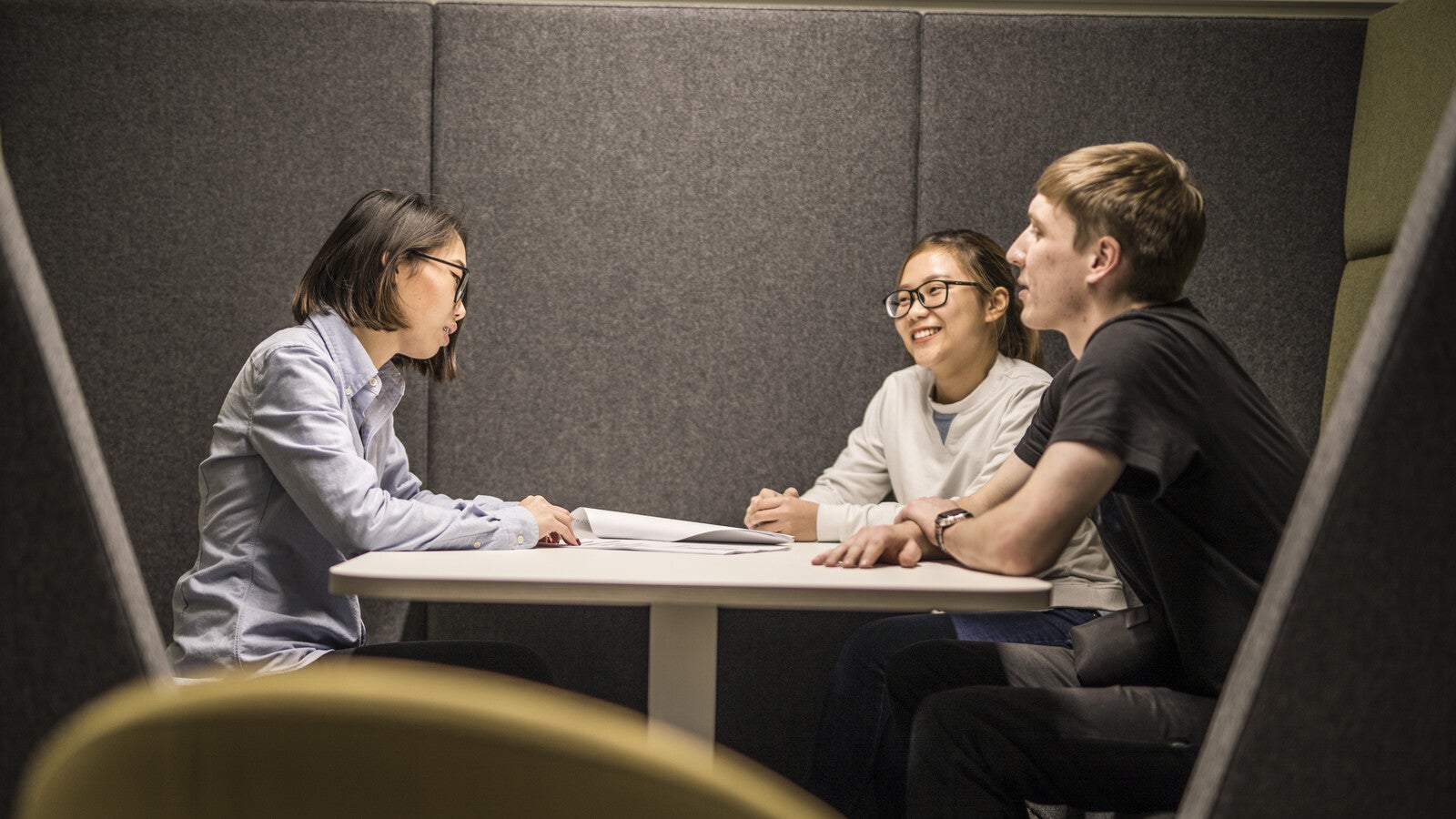 Three students studying together at a table