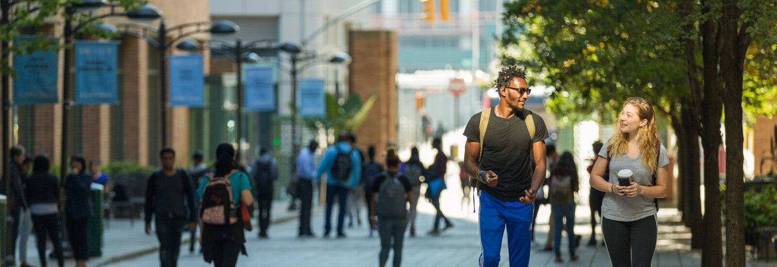 Two students walking outside campus