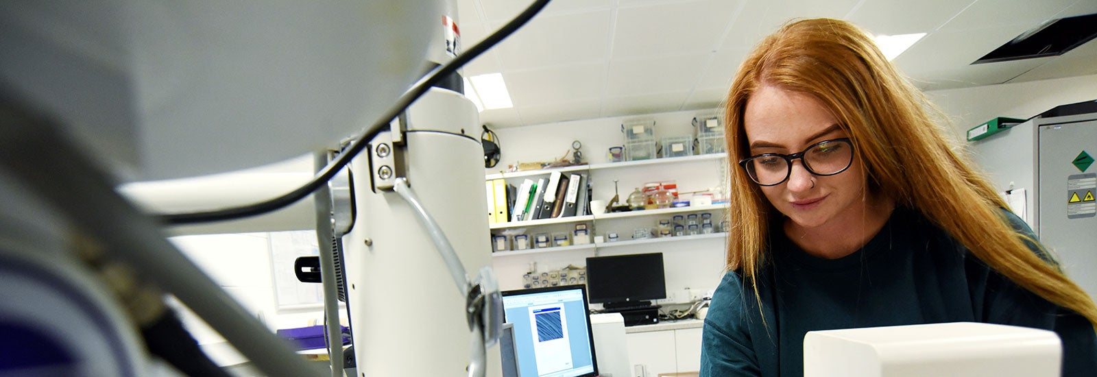 An engineering student in a science lab