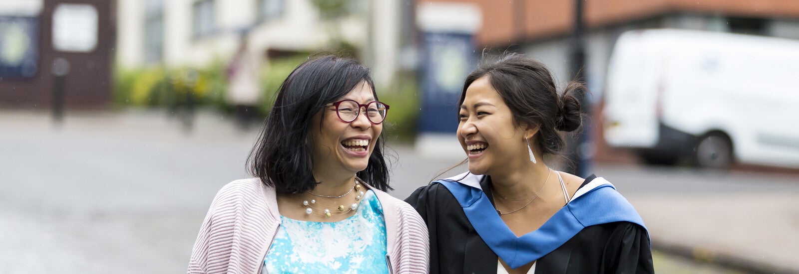 A graduating international student celebrating with family.