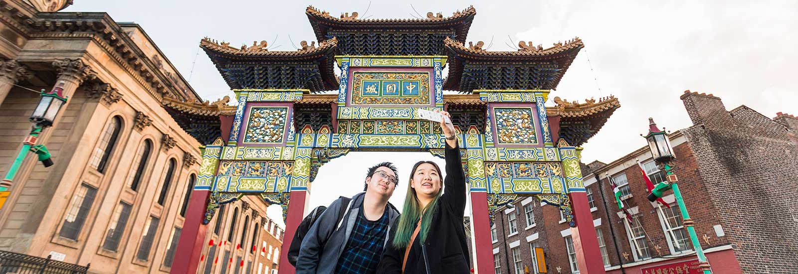 Two students taking a selfie in Chinatown