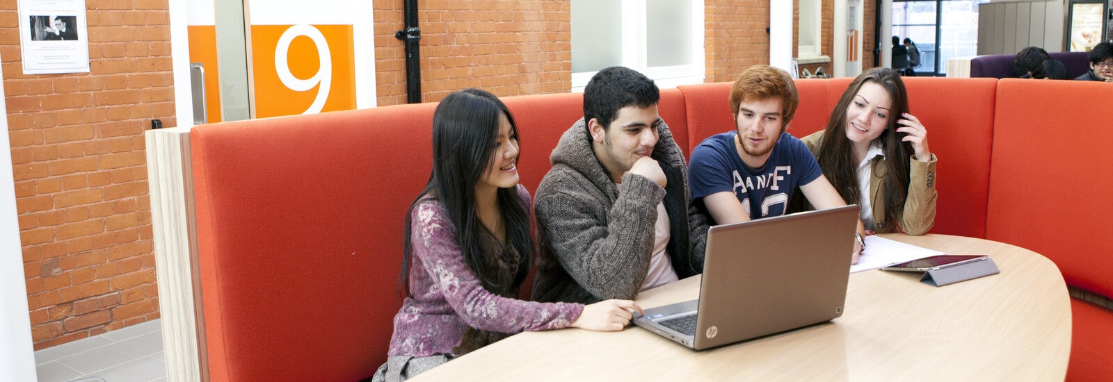 Students using laptop on campus