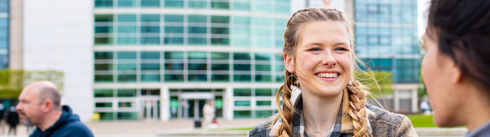 Student smiling outside campus 