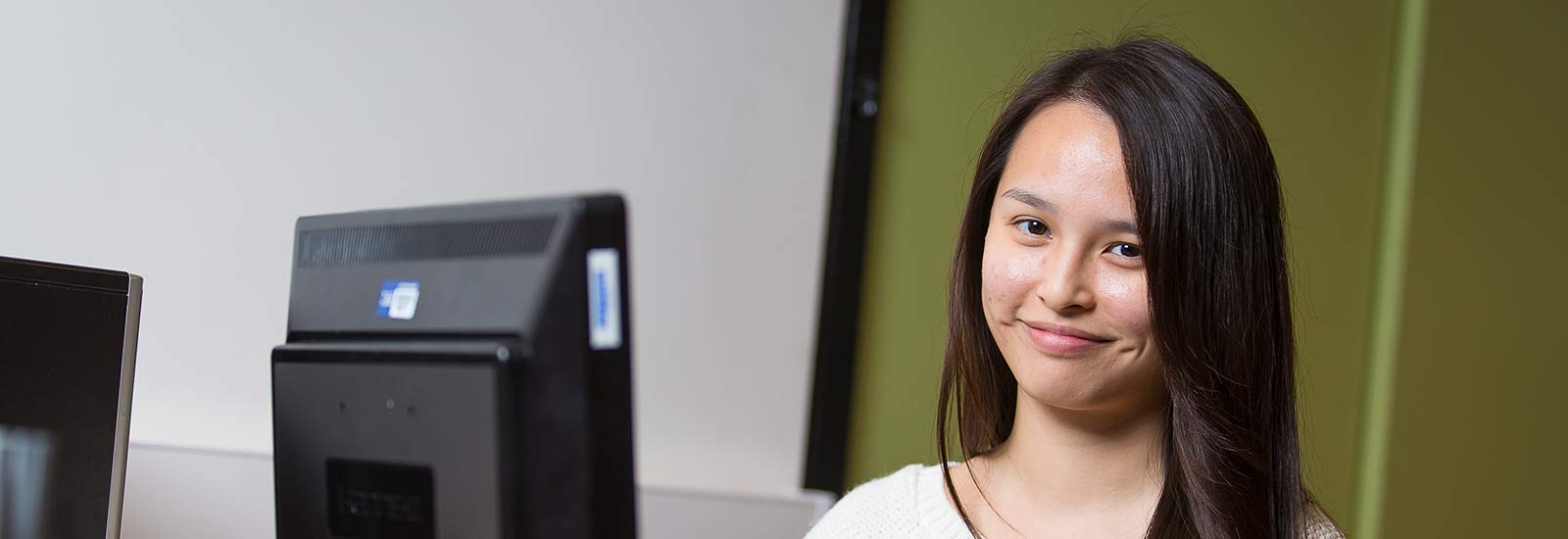 An international student smiling in Liverpool.