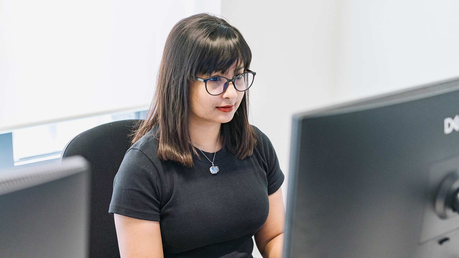 A University of Huddersfield London student on a PC