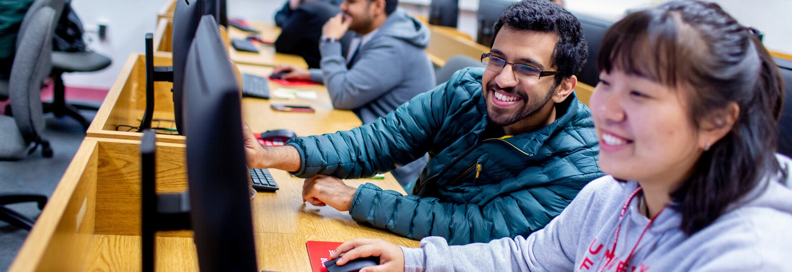 Students working together in a computer lab.