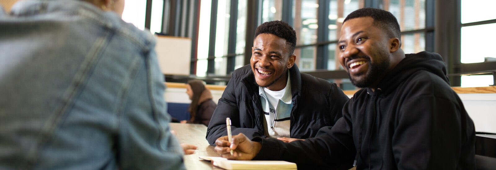 Students laughing together on campus
