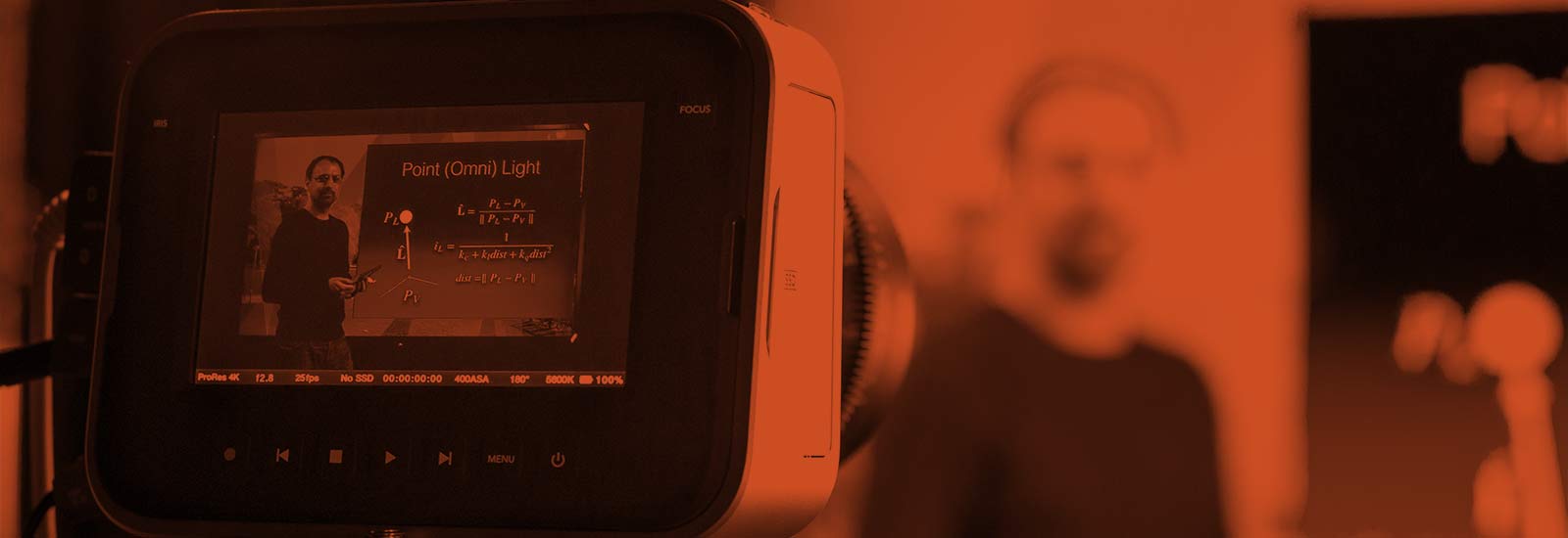 A student filming in a studio