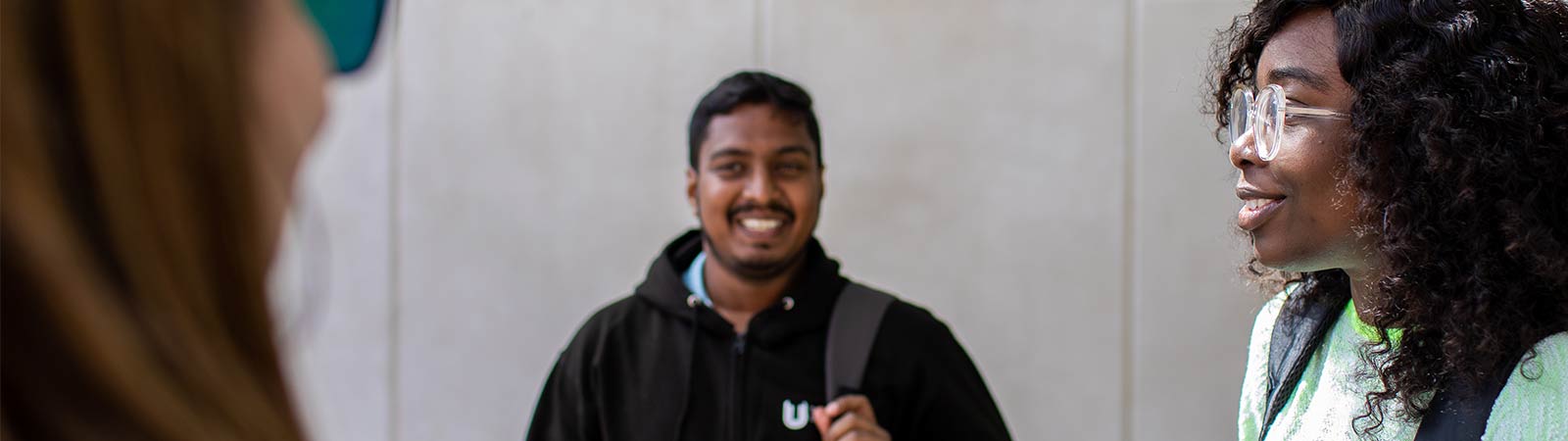 Students talking outside campus