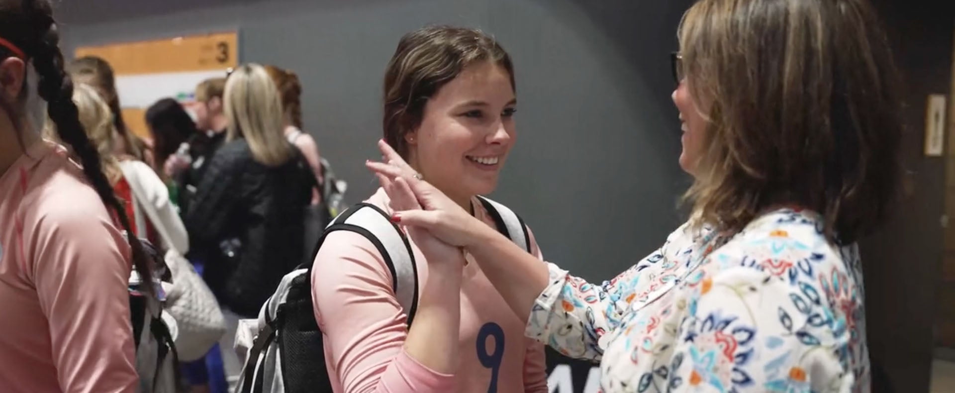 Sherie Holland with daughter at volleyball game