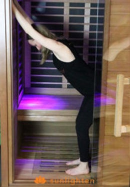Leaning forward stretch in sauna