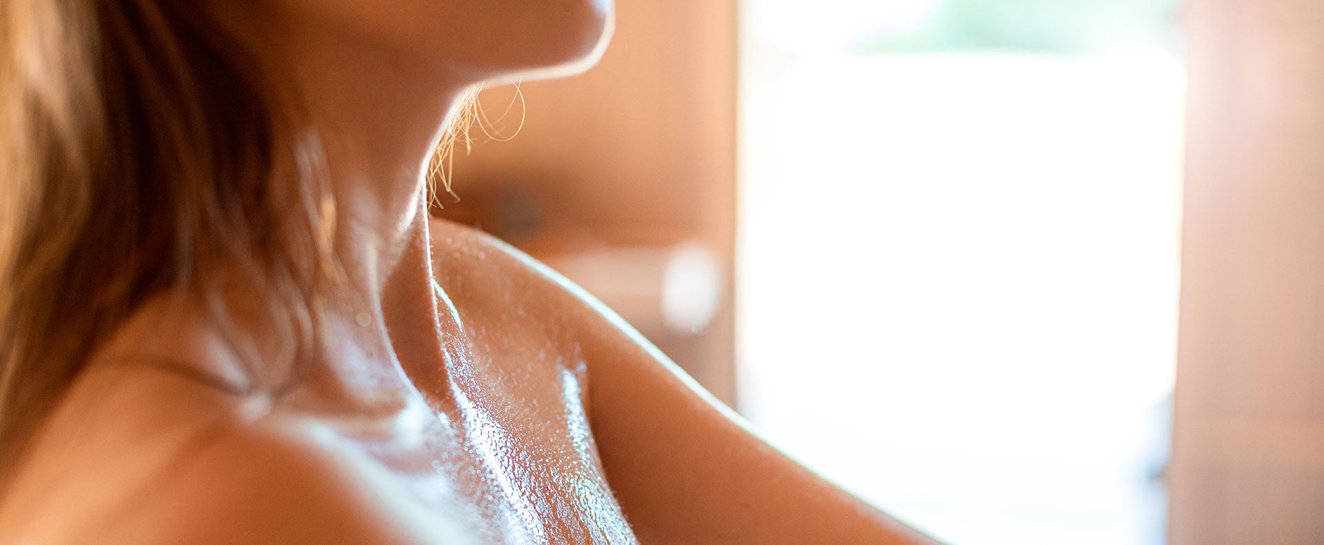 Woman sweating in a sauna