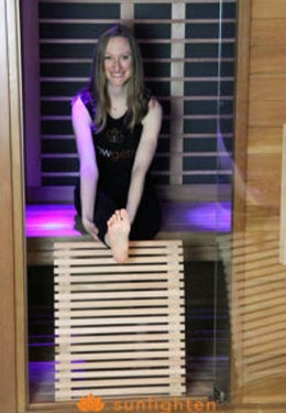 Seated leg stretch in sauna