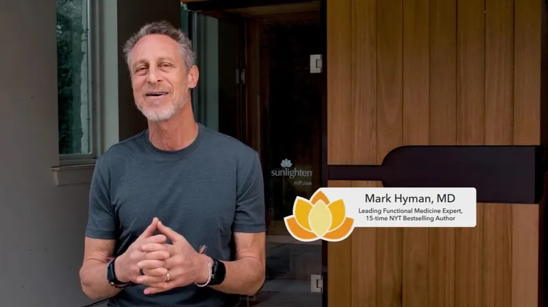 Mark Hyman sits in front of a Sunlighten mPulse sauna