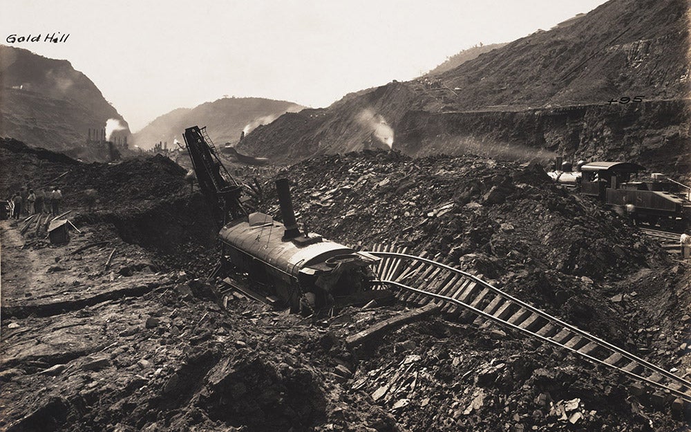 Steam shovel #201 sits amidst upheaved material, February 6, 1913.
 Pressure on the sides of the Canal could cause material to push up from below and “swallow” equipment. Gaillard described standing on ground in the Cut that rose six feet in five minutes with a smooth almost imperceptible motion.  View in Digital Collection »