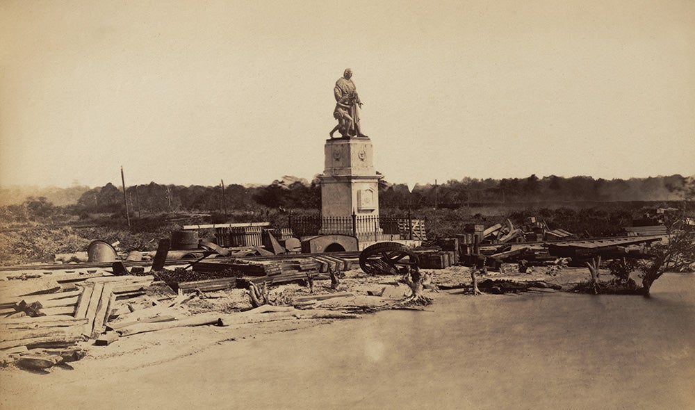 Columbus statue in rail yard, Colón. From A.B. Nichols Notebooks. View in Digital Collection »