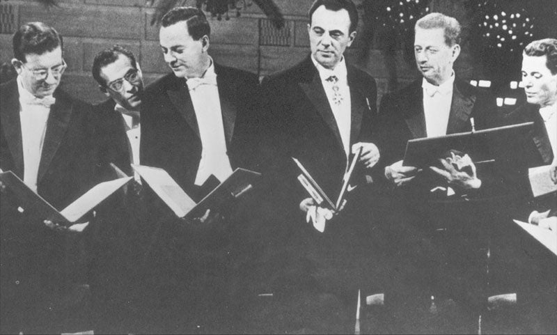 Nobel Prize recipients for 1965; Robert Woodward is at far left, showing his award to physicists Julian Schwinger and Richard Feynman, who have awards of their own that look just like it, Caltech Archives (digital.archives.caltech.edu)