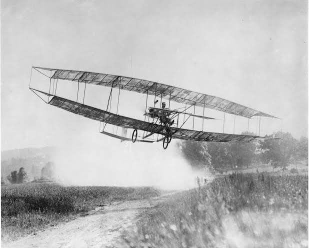 June Bug in the air, designed by Glenn Curtiss, with Curtiss at the controls, July 4, 1908 (the-leader.com)