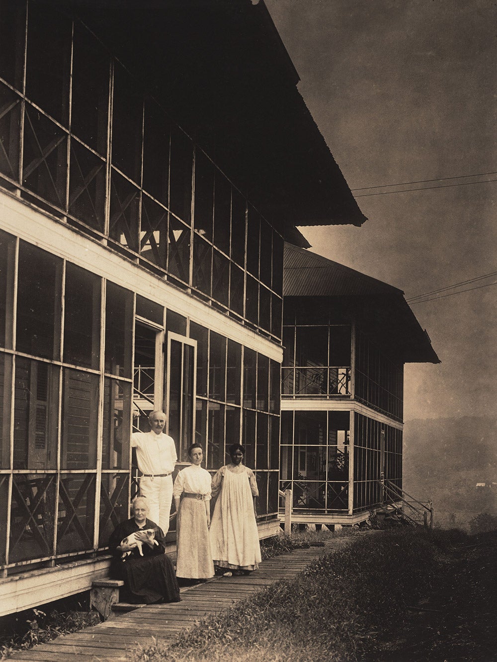 A.B. Nichols in front of his home, with (presumably) his wife, daughter, servant, and pet cat, in 1905.
A.B. Nichols lived briefly at Gatun and Empire before settling at Culebra, where he served as Office Engineer for the Isthmian Canal Commission throughout the construction of the Canal. His relatively high salary entitled him to a large, comfortable home.
View in Digital Collection»