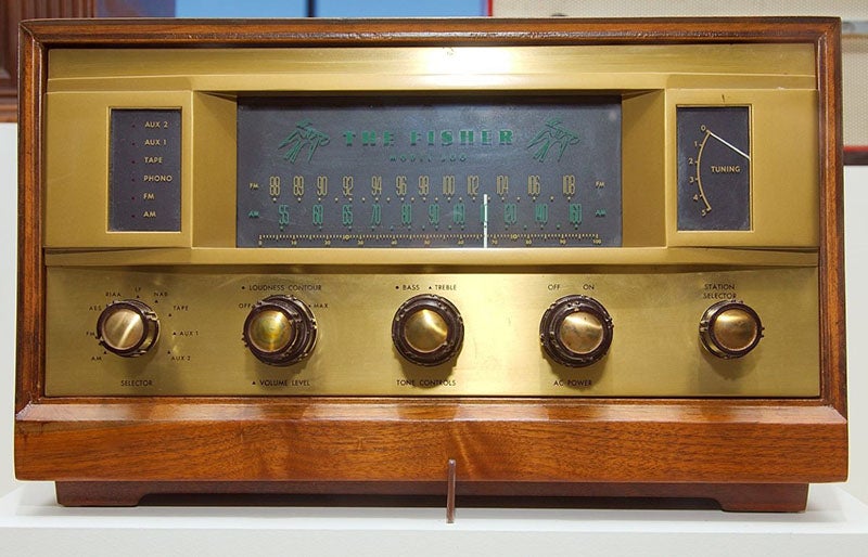 Front panel of a Fisher 500 tuner, 1959, with the name “The Fisher” flanked by Fisher logos of a dove carrying a semi-quaver.
