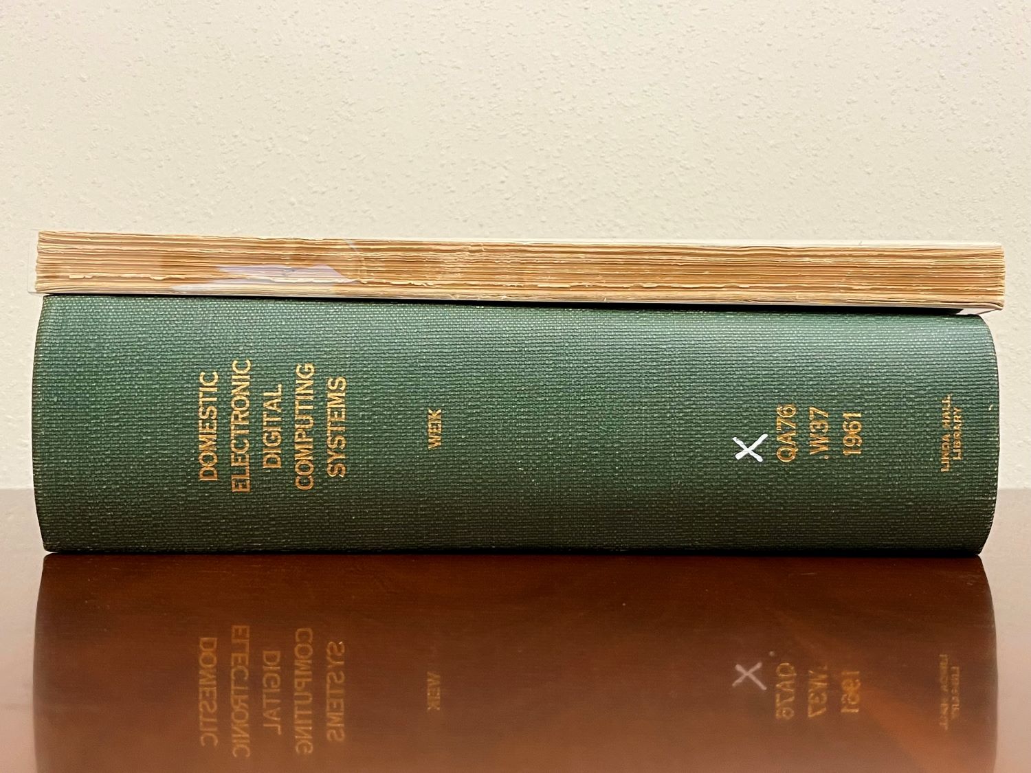 The 1955 survey atop the 1961 survey, with a green binding.