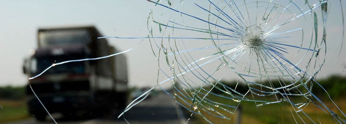 Inside of the car with windshield that was broken in car accident. Find Comprehensive Insurance.