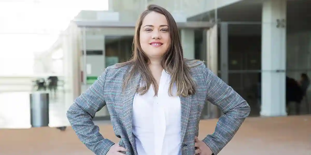 Woman standing tall after hearing the State of Frontline Leadership in 2020