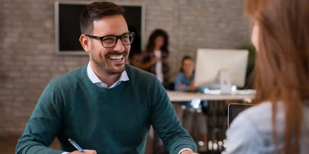 Coworkers discussing strategies for new CEO success