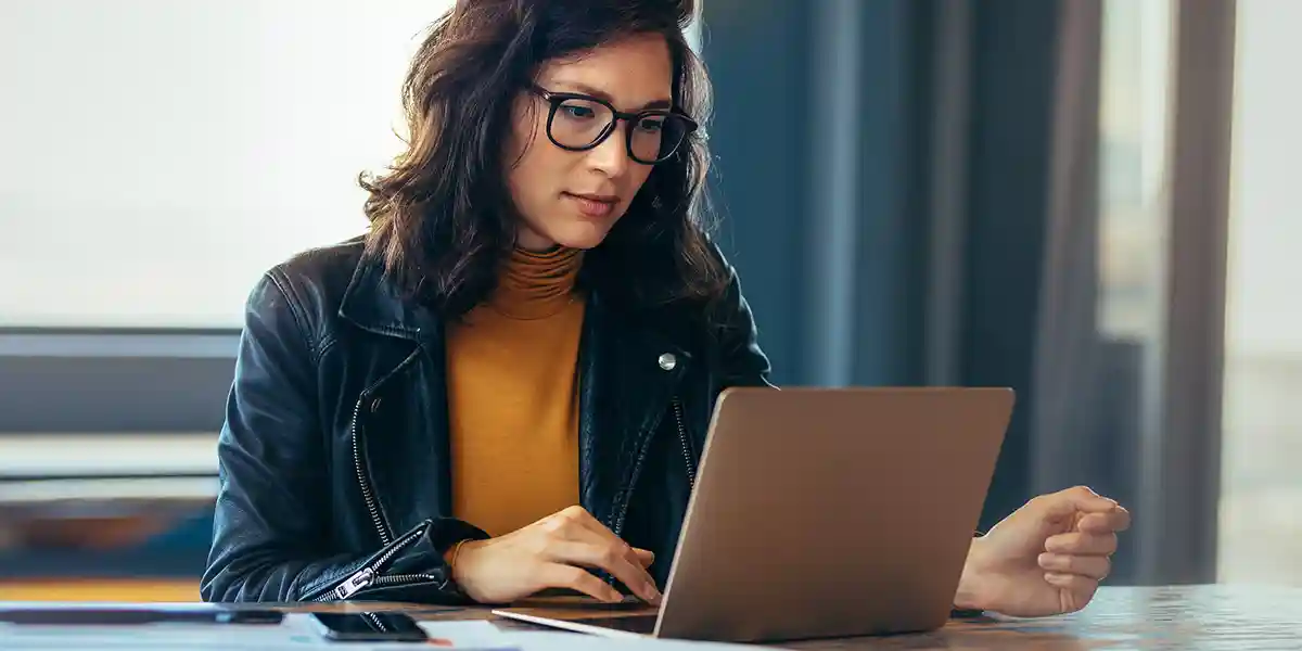 Woman at computer developing high-potential program,HiPo program