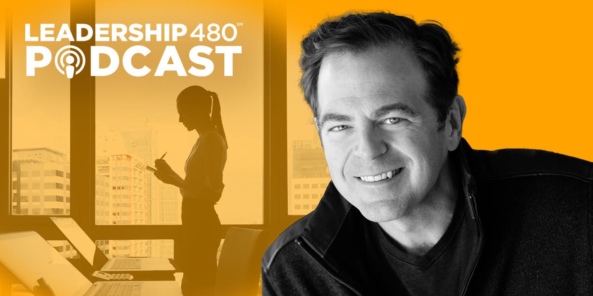headshot of author Dr. Kevin Fleming with image of woman leader standing in an office building overlooking skyscrapers to represent mental health in the workplace in this episode of the Leadership 480 podcast