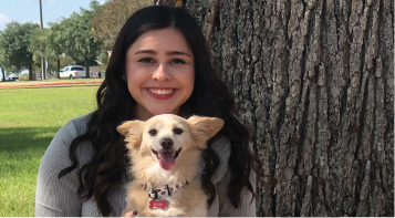 photo of Ashley Cubb holding her small dog