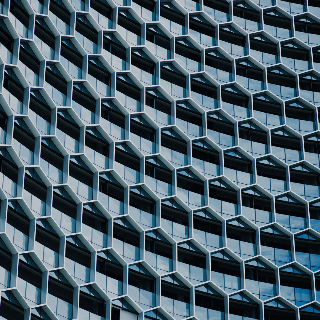 A building with a hexagonal frame in front of the windows similar to that of a Carbon molecule