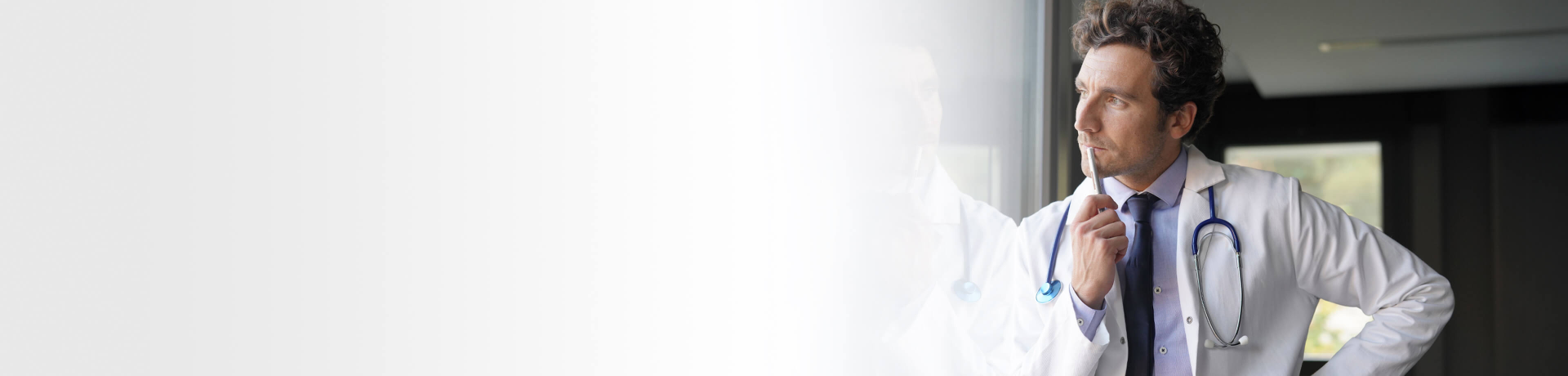 Doctor looking at window