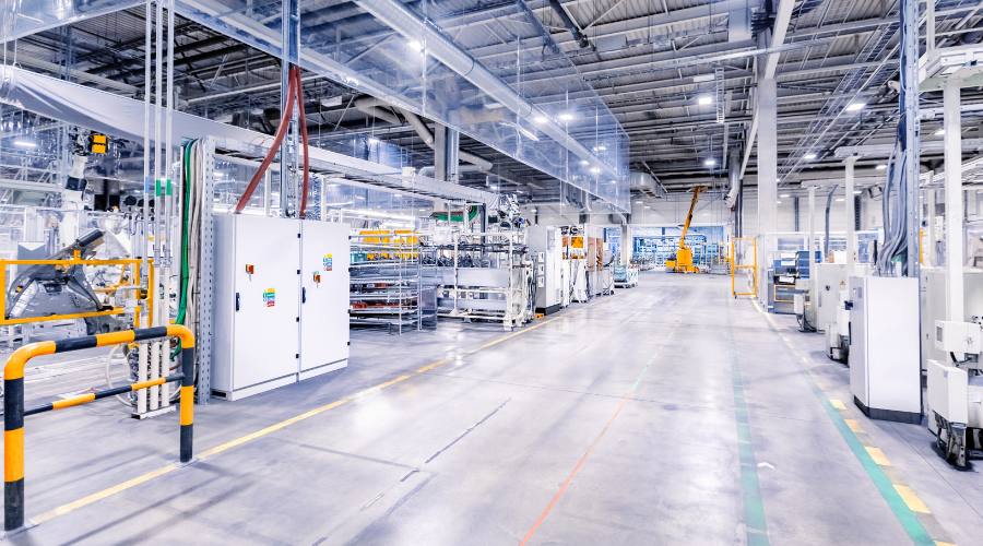 Interior of a large industrial facility with machinery and equipment.