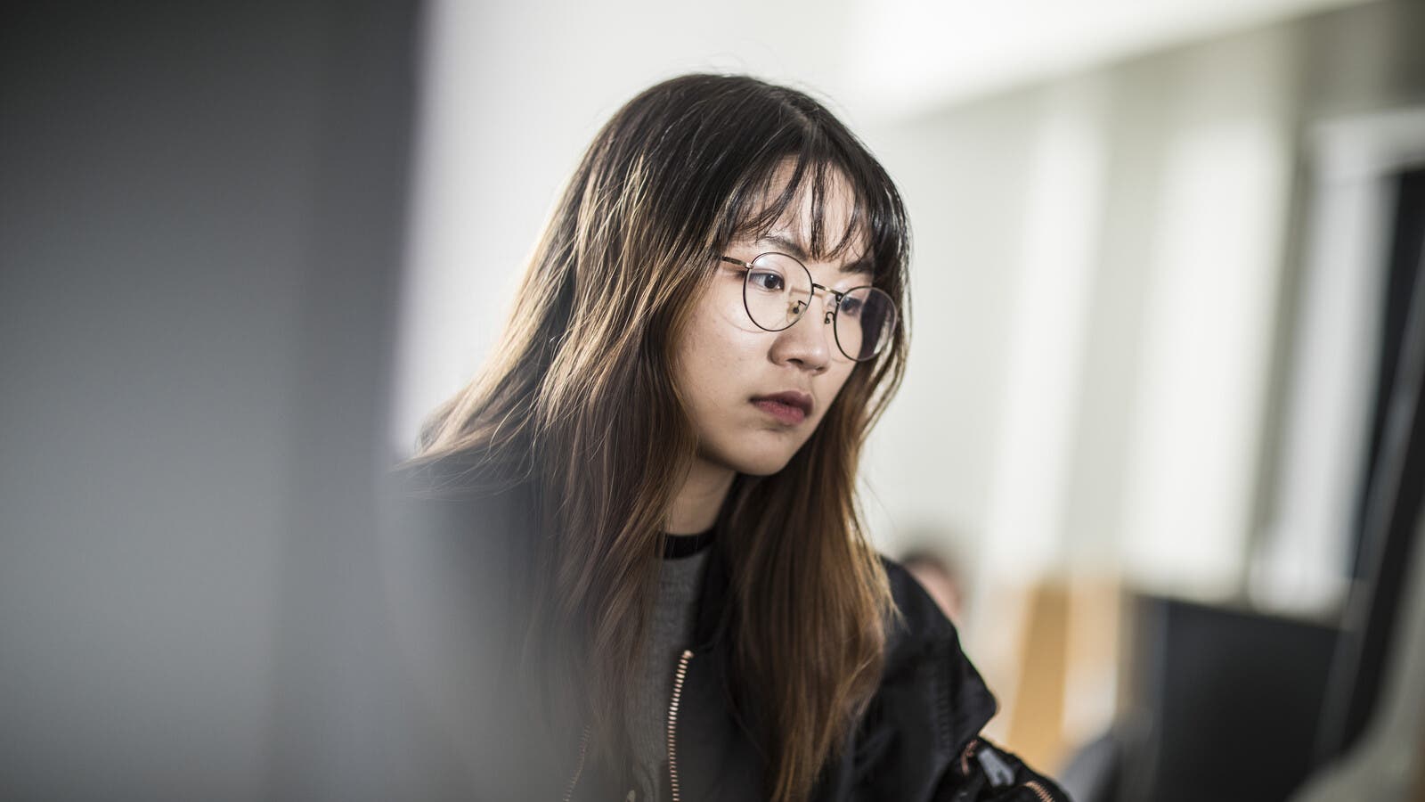 A female student using a computer