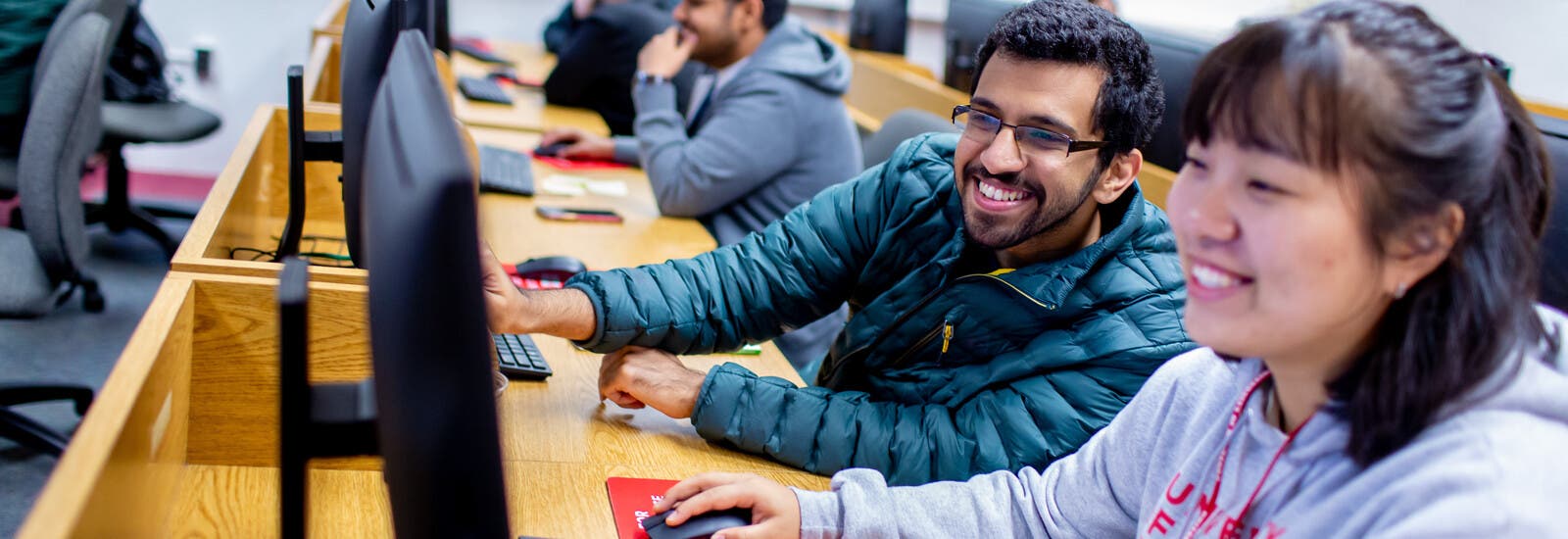 Students working together in a computer lab.
