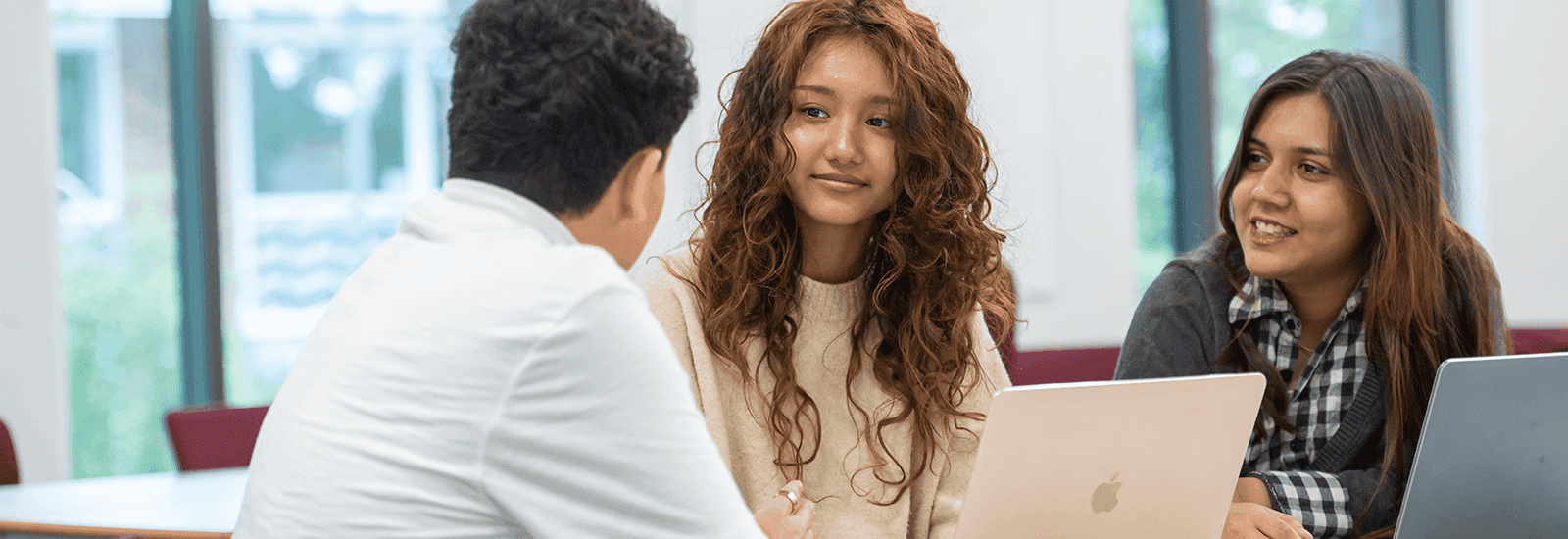 Three international students during class