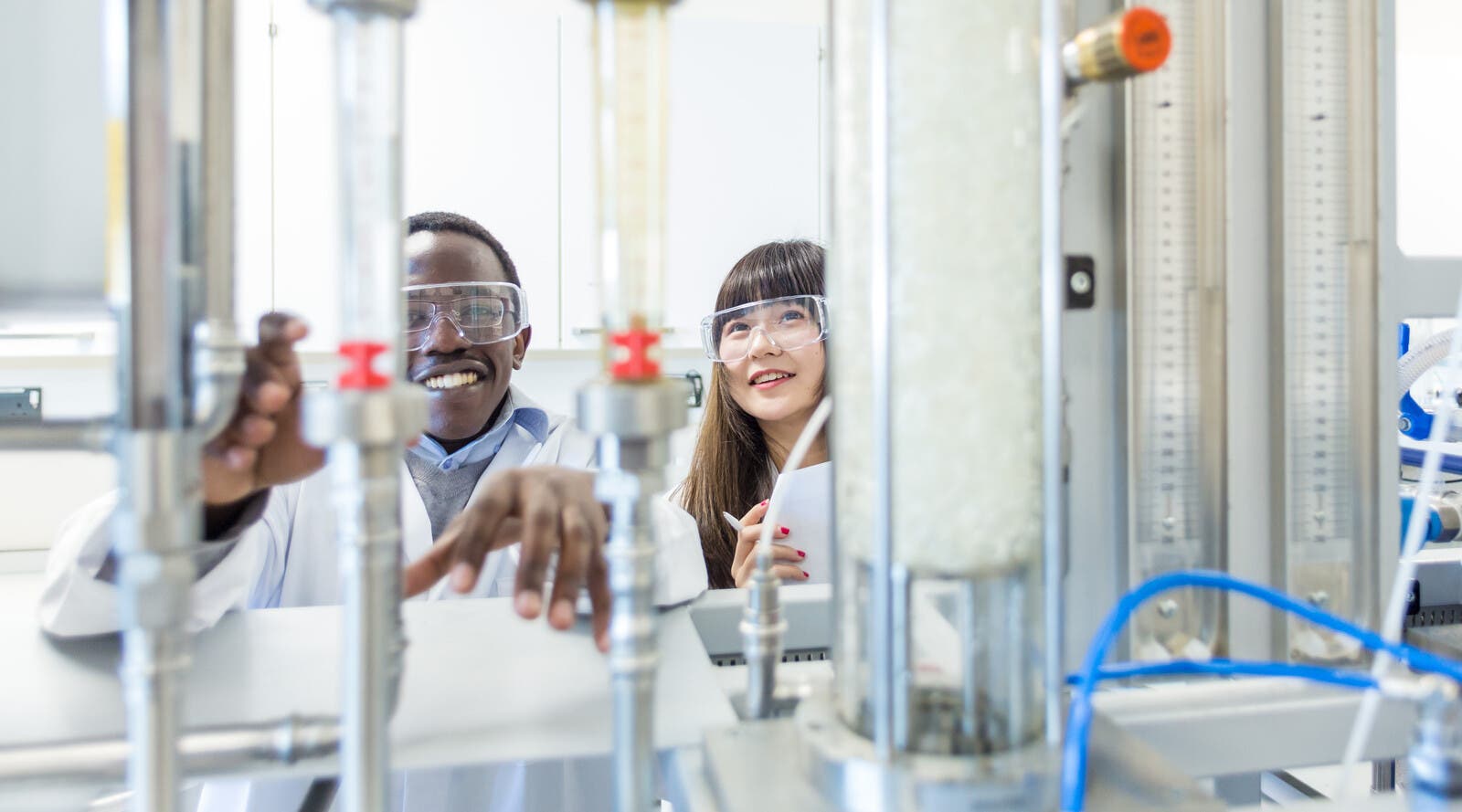 Two students in a scientific laboratory.