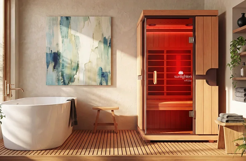 The mPulse Aspire 1 person infrared sauna with red light therapy in a bathroom.