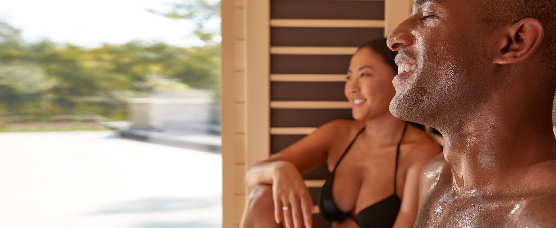 Couple sweating in sauna